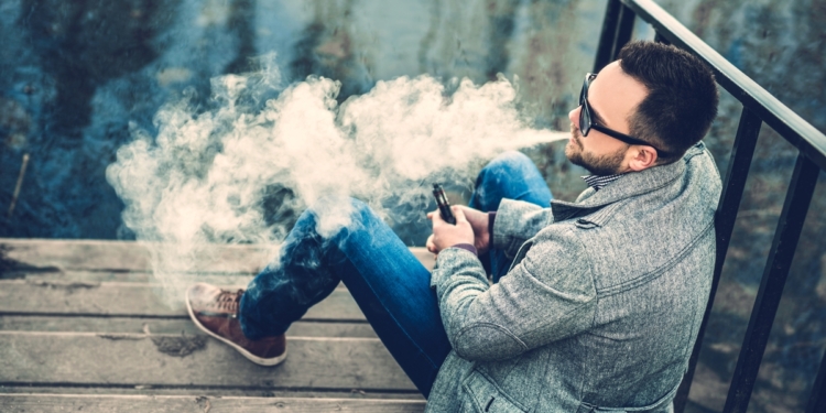 Man vaping outdoors